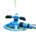 Blue Rotating Garden Sprinklers Watering Grass